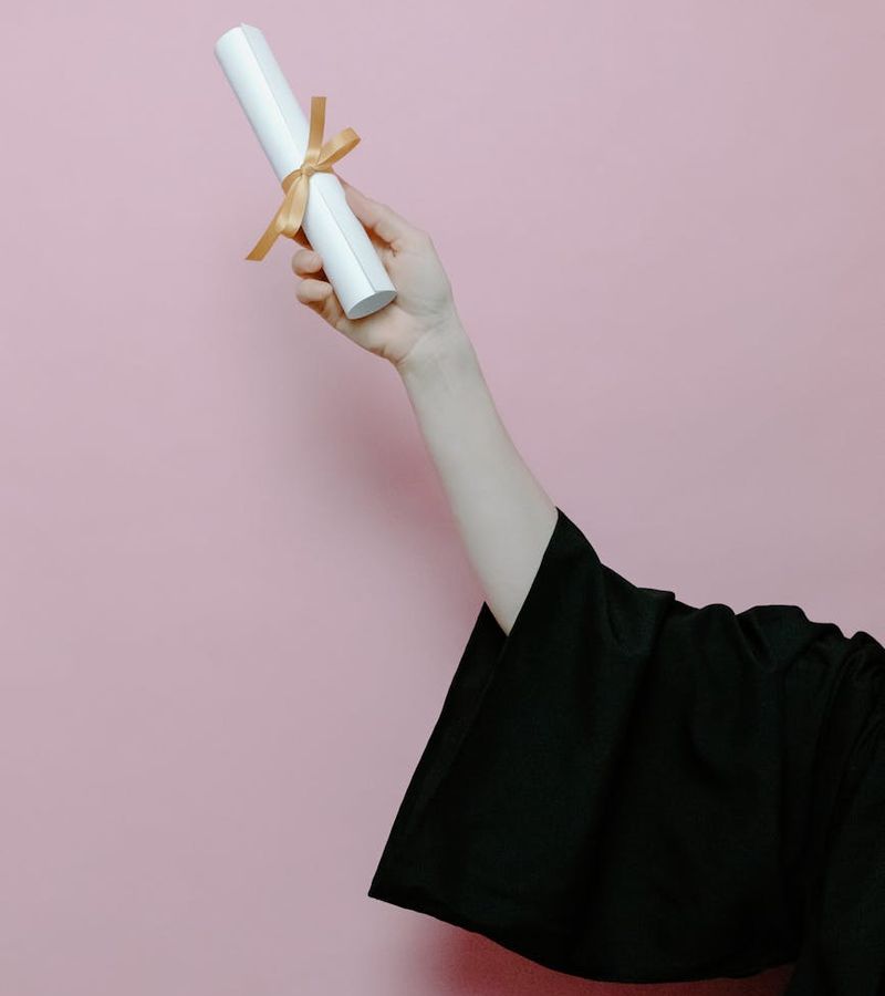 Student receiving international academic certificate with pride